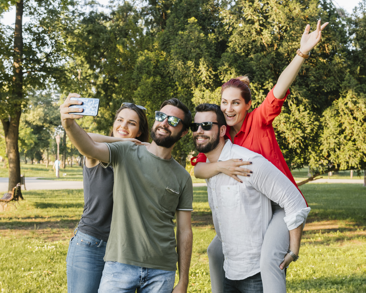 group-joyful-adult-friends-taking-selfie-together